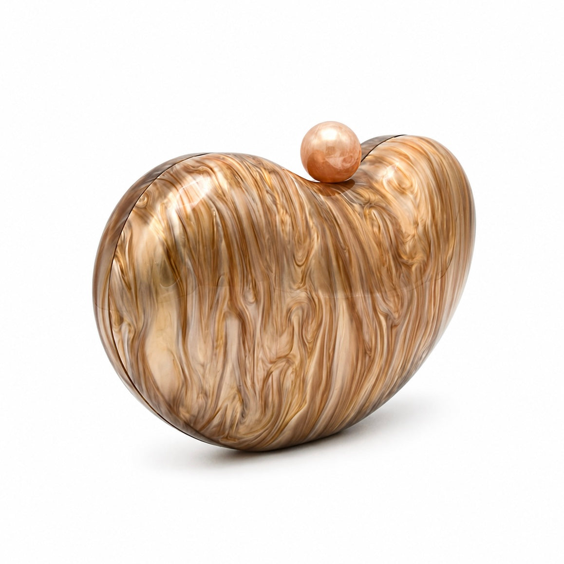 L’APOGÉE Solace in Caramel sculptural rounded acrylic evening bag featuring warm caramel marbled tones, glossy finish, and chunky gold chain detailing designed for dinners, formal events, and elegant occasion styling.