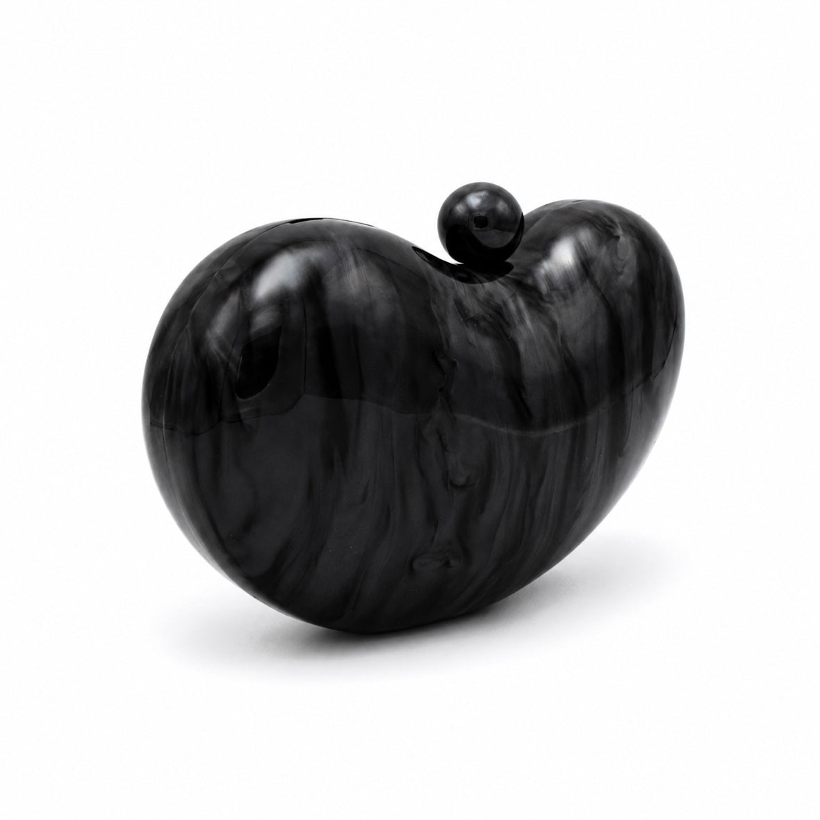 L’APOGÉE Solace in Black sculptural rounded acrylic evening bag featuring glossy black marbled tones and a sleek statement silhouette designed for formal events, evening dinners, and timeless elegant styling.