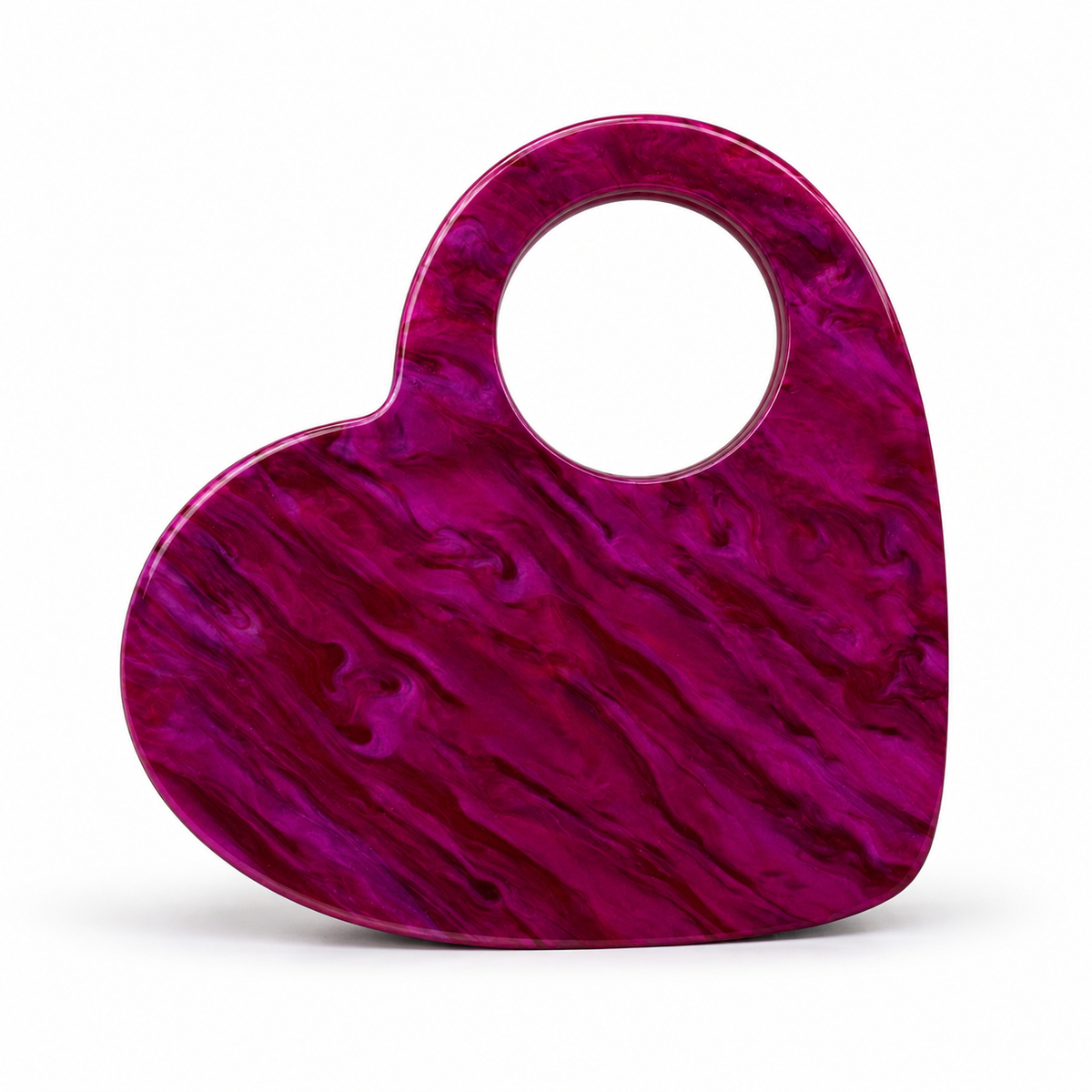 L’APOGÉE Te Amo fuchsia marbled heart-shaped acrylic bag designed for date nights, weddings, parties, and bold statement occasion styling.