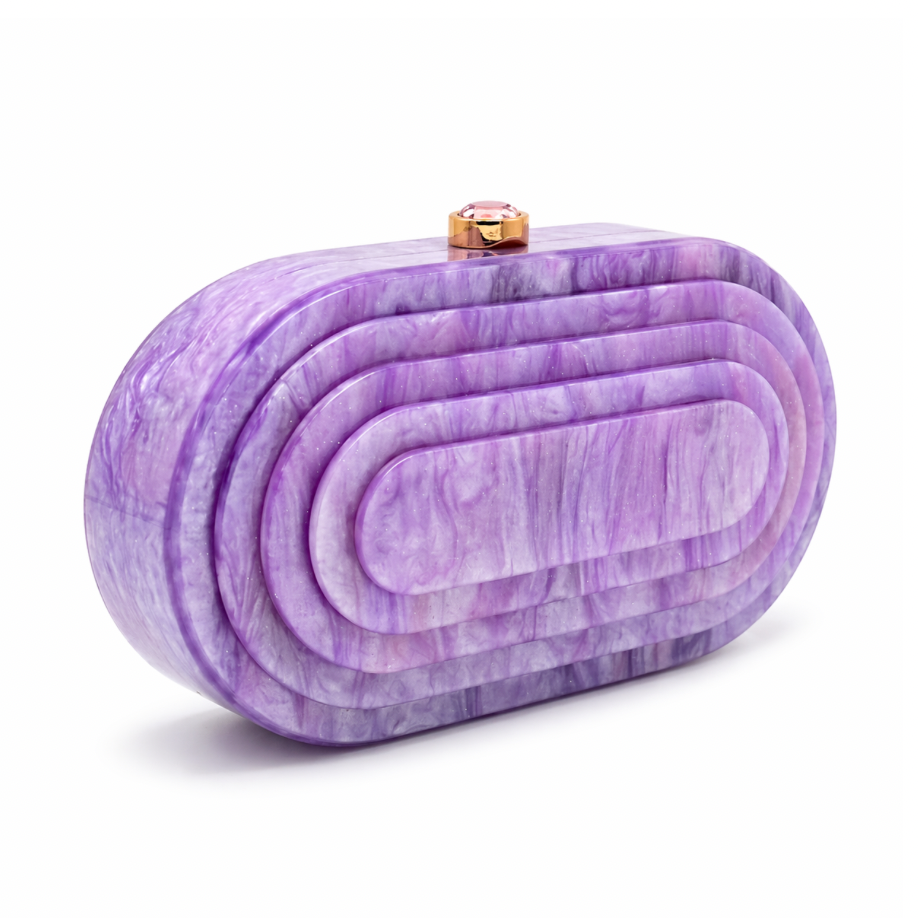 L’APOGÉE Olympia in Lila layered oval acrylic clutch featuring soft lilac marbled tones and a sculptural concentric silhouette designed for parties, weddings, and feminine occasion styling.