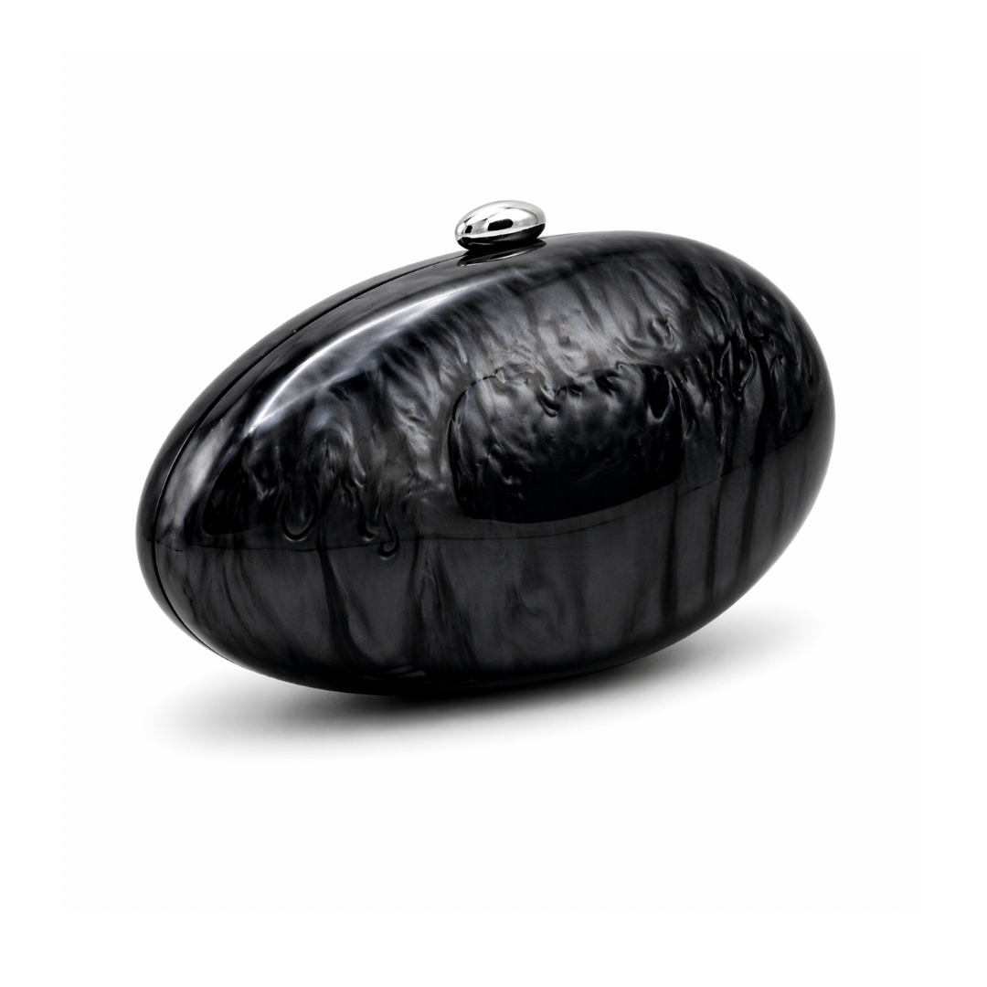 L’APOGÉE Calypso in Black sculptural oval acrylic evening bag featuring glossy black tones and a rounded statement silhouette designed for formal events, evening dinners, and elegant night styling.