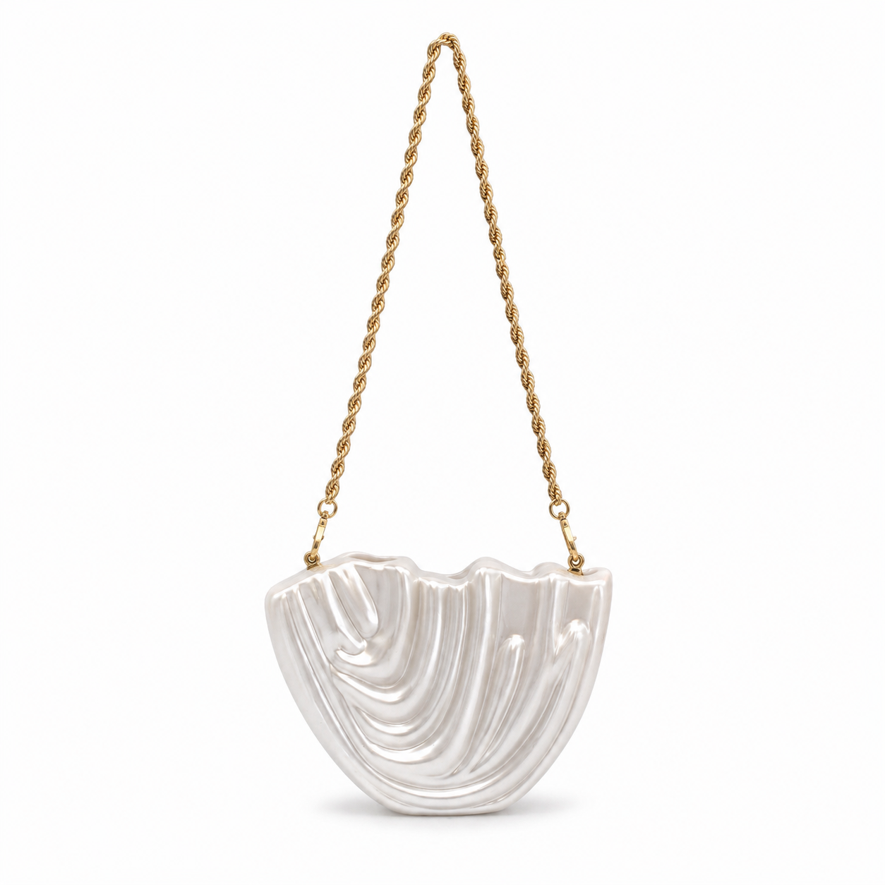 L’APOGÉE Drapée in Pearl sculptural acrylic clutch featuring pearly ivory finishes, flowing carved textures, and an artistic organic silhouette designed for bridal styling, elegant evenings, and contemporary luxury fashion moments.