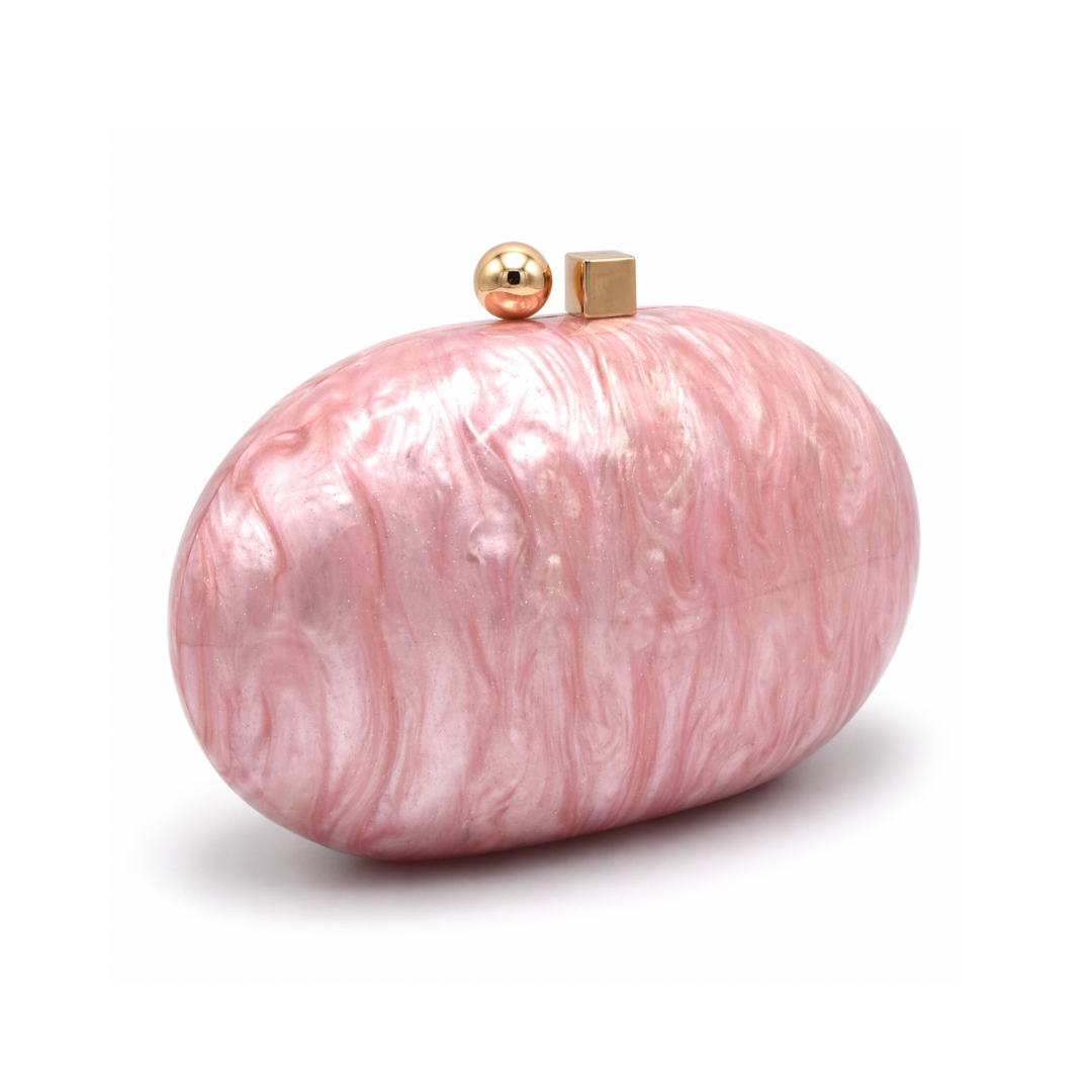 L’APOGÉE Pluto in Pink round sculptural acrylic evening bag featuring glossy pink marbled tones and a statement circular silhouette designed for parties, brunches, date nights, and feminine occasion styling.
