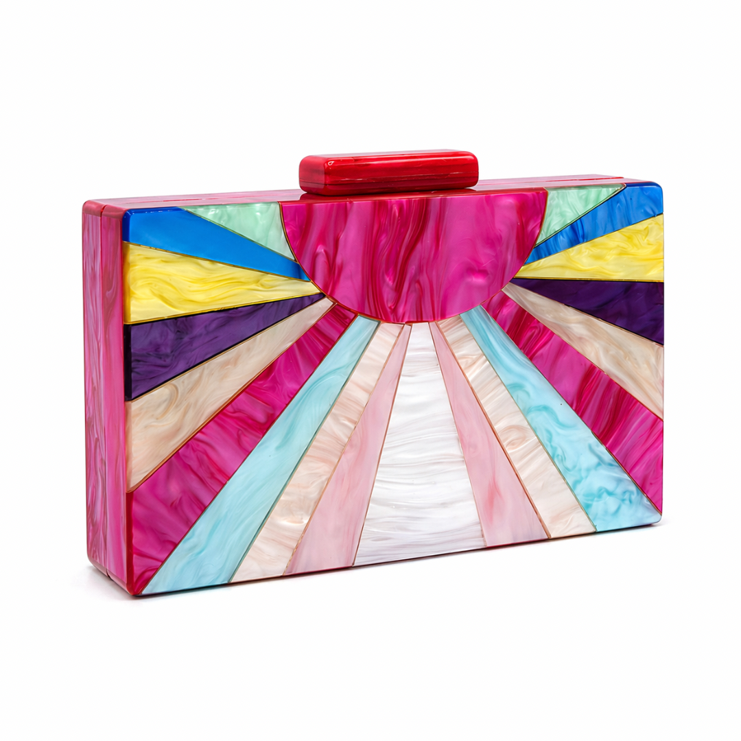 L’APOGÉE Spark rectangular acrylic clutch featuring multicolor marbled tones in pink, blue, yellow, ivory, and lilac with a bold sunburst design created for parties, fashion events, and statement styling.
