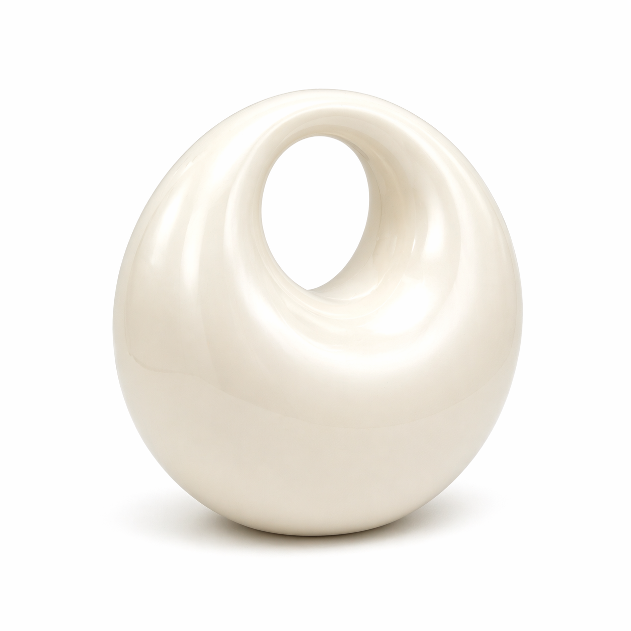 L’APOGÉE Lunelle sculptural acrylic clutch featuring a glossy pearly ivory finish, rounded donut-inspired silhouette, and smooth circular cutout handle designed for modern bridal styling and contemporary luxury evening looks.