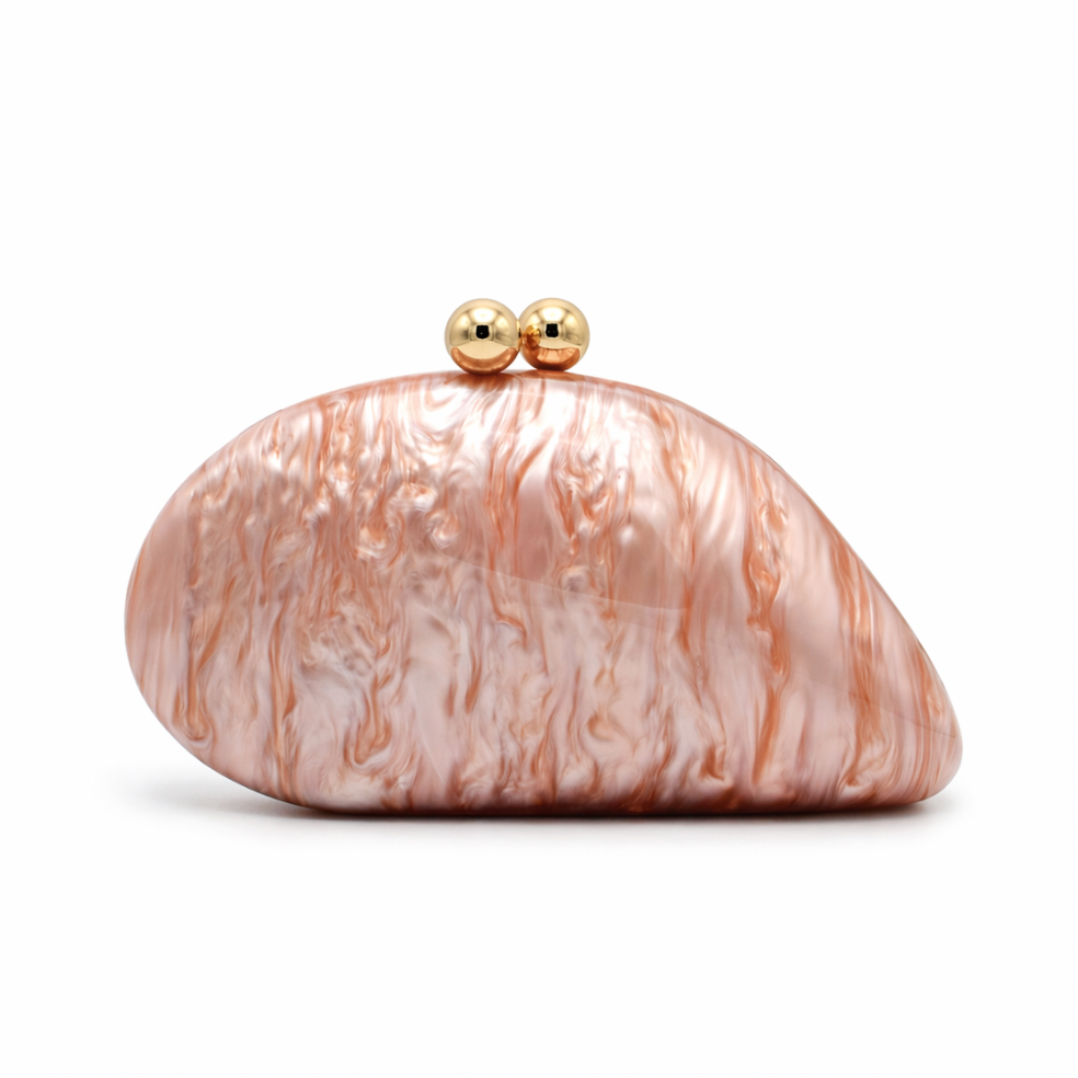 L’APOGÉE Alexandria in Rosewood shell-shaped acrylic evening bag featuring soft rosewood marbled tones and a sculptural curved silhouette designed for weddings, dinners, and elegant statement occasion styling.