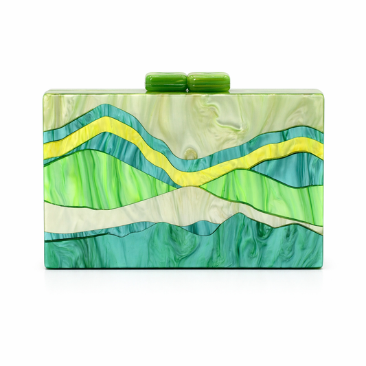 L’APOGÉE Alps green, yellow, and blue marbled acrylic clutch inspired by mountain landscapes designed for vacations, weddings, formal events, and statement occasion styling.