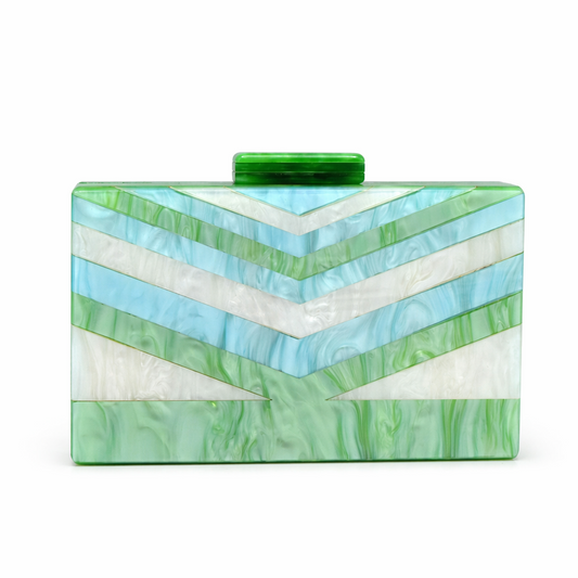 L’APOGÉE Aquaaura geometric acrylic clutch featuring layered chevron patterns in mint green, aqua blue, and pearly white with a structured rectangular silhouette designed for resort styling, summer events, and artistic fashion looks.
