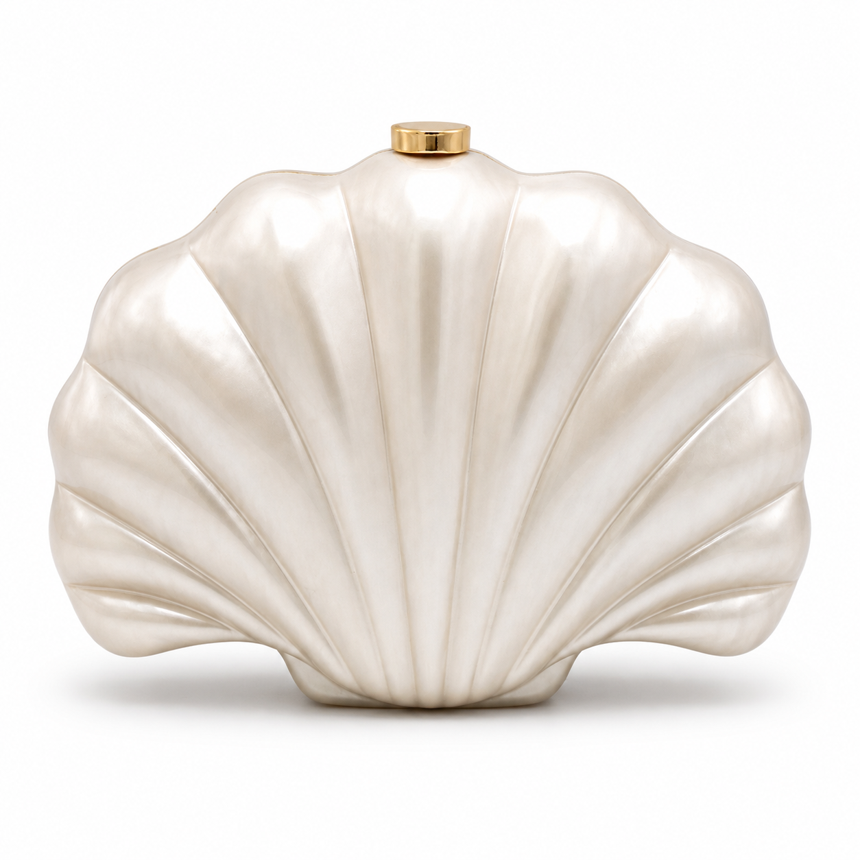 L’APOGÉE Ariel pearly acrylic clutch featuring a sculptural seashell silhouette with glossy ivory pearl tones designed for weddings, seaside events, bridal looks, and elegant evening styling.