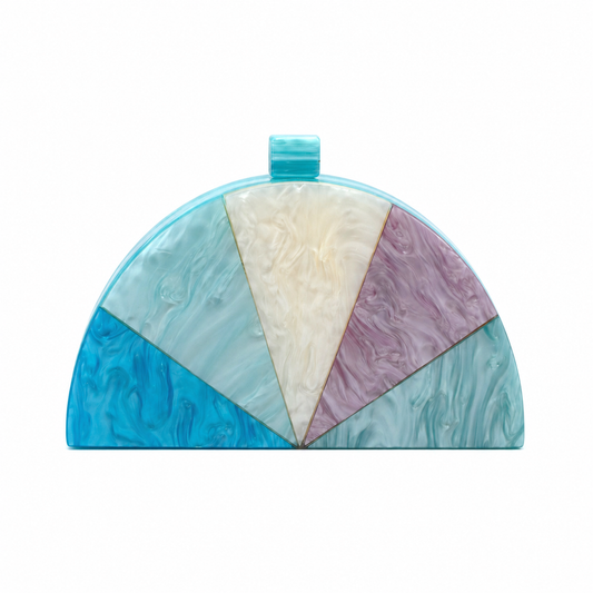 L’APOGÉE Bermuda geometric acrylic clutch featuring aqua blue, ivory, and lilac marbled tones with a sculptural half-moon silhouette designed for vacations, brunches, and artistic statement occasion styling.