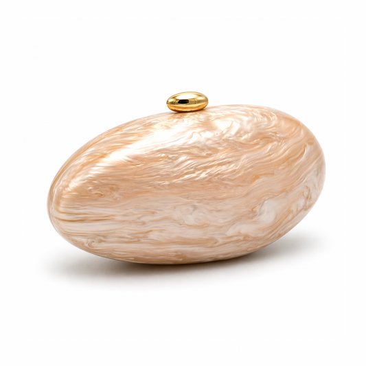 L’APOGÉE Calypso in Beige sculptural oval acrylic evening bag featuring glossy beige marbled tones and a rounded statement silhouette designed for weddings, brunches, and elegant occasion styling.