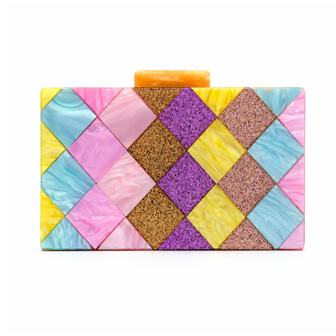 L’APOGÉE Eden rectangular acrylic clutch featuring geometric pastel panels in pink, yellow, aqua blue, lilac, and glitter textures designed for playful statement styling, parties, and colorful fashion moments.