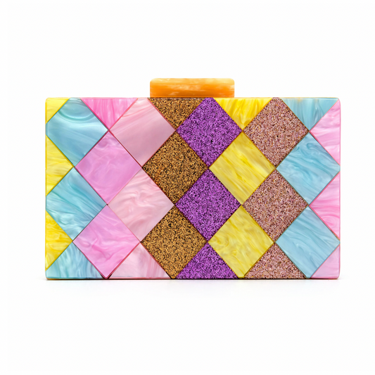 L’APOGÉE Eden rectangular acrylic clutch featuring geometric pastel panels in pink, yellow, aqua blue, lilac, and glitter textures designed for playful statement styling, parties, and colorful fashion moments.
