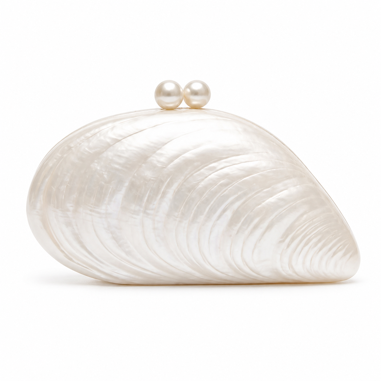 L’APOGÉE Elefteria pearl shell-shaped evening bag available in pearl, beige, and black designed for weddings, luxury dinners, vacations, and elegant occasion styling.