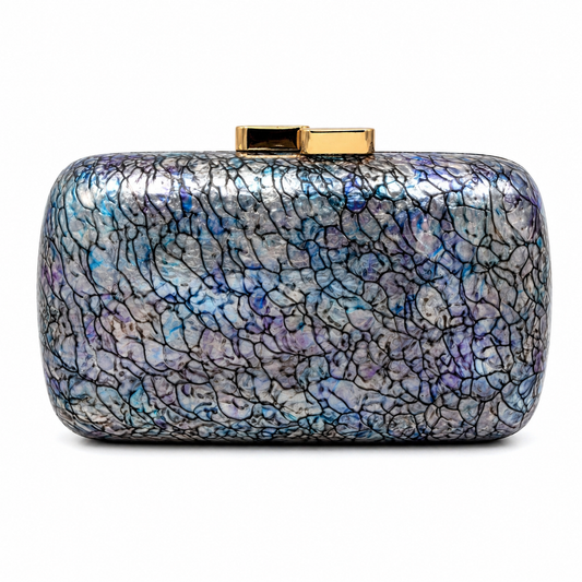 L’APOGÉE Elektra rectangular acrylic clutch featuring iridescent cracked textures in silver, blue, violet, and black with a glossy structured silhouette designed for futuristic evening styling and statement fashion moments.