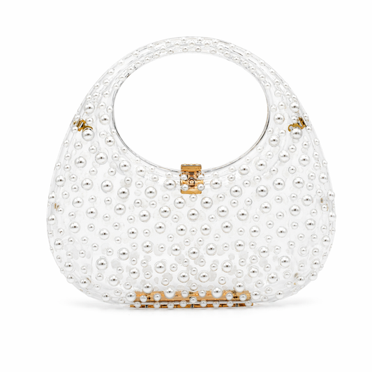 L’APOGÉE Éternelle pearl embellished evening bag featuring glossy ivory finishes, intricate pearl detailing, and an elegant rounded silhouette designed for bridal styling and sophisticated luxury occasions.