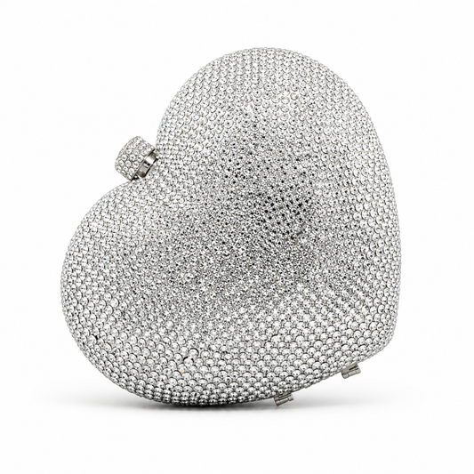 L’APOGÉE Love heart-shaped rhinestone evening bag in silver designed for weddings, date nights, formal events, and glamorous occasion styling