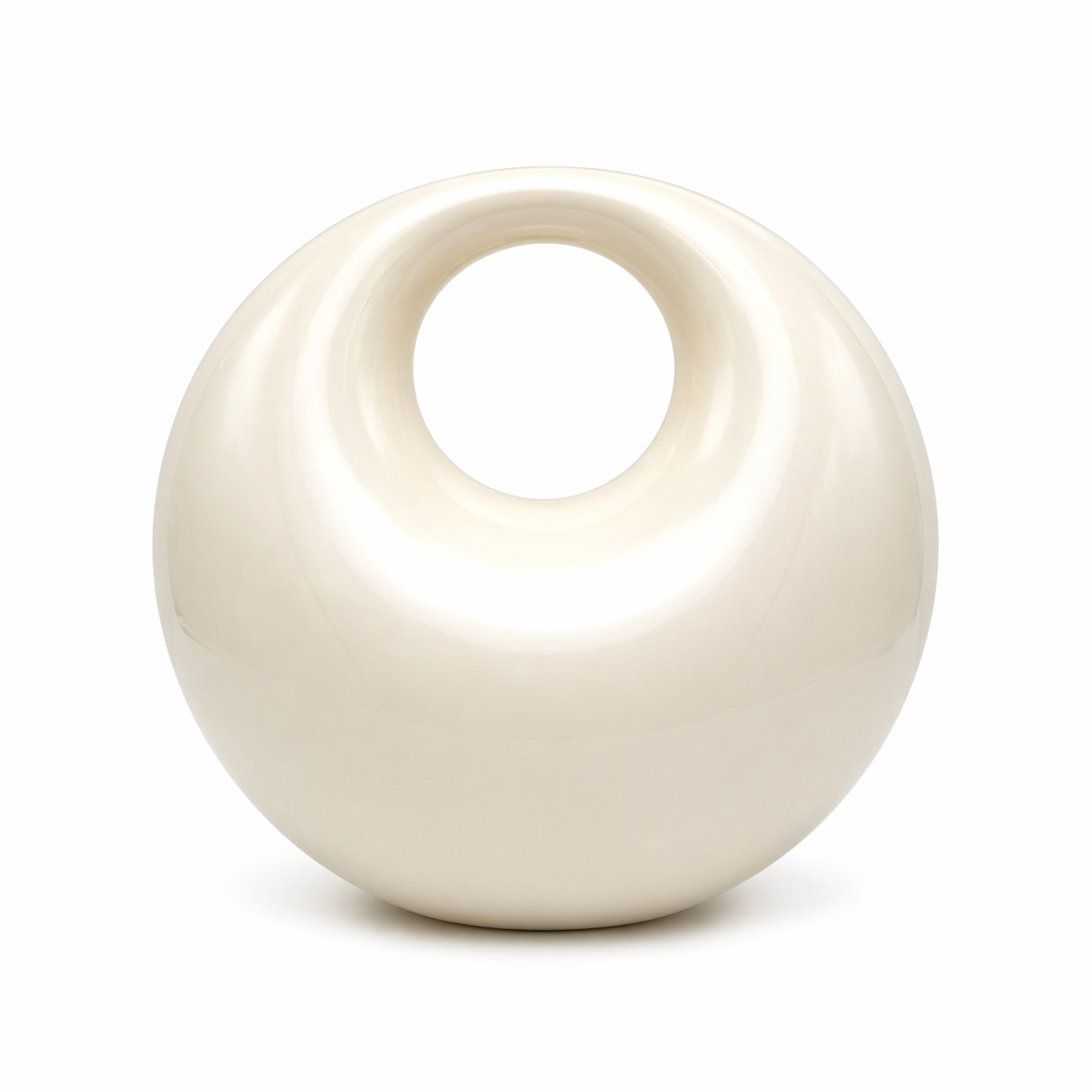 L’APOGÉE Lunelle sculptural acrylic clutch featuring a glossy pearly ivory finish, rounded donut-inspired silhouette, and smooth circular cutout handle designed for modern bridal styling and contemporary luxury evening looks.