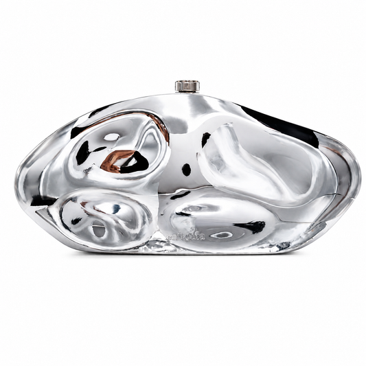 L’APOGÉE Moon in Silver sculptural acrylic evening bag featuring a futuristic metallic design for weddings, formal events, and statement occasion styling.