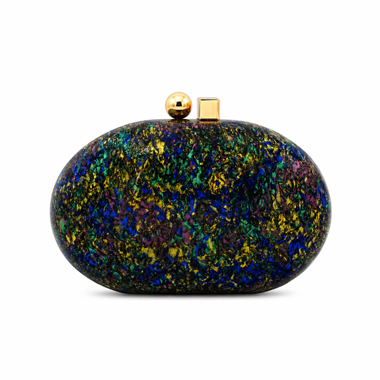 L’APOGÉE Muriphée oval acrylic clutch featuring iridescent blue, gold, purple, and black textured finishes with a smooth pebble-inspired silhouette designed for futuristic evening styling and statement party looks.