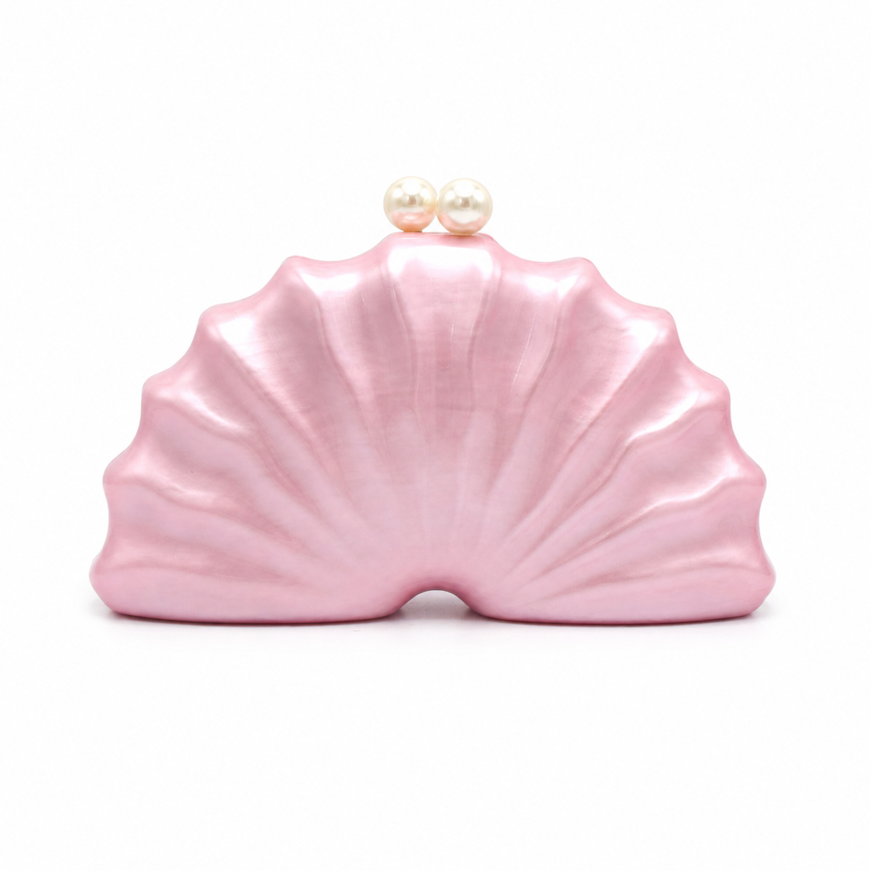 L’APOGÉE Naïelle shell-inspired acrylic clutch featuring soft blush pink finishes, sculptural oceanic curves, and pearl clasp detailing designed for feminine evening styling and elegant statement fashion looks.