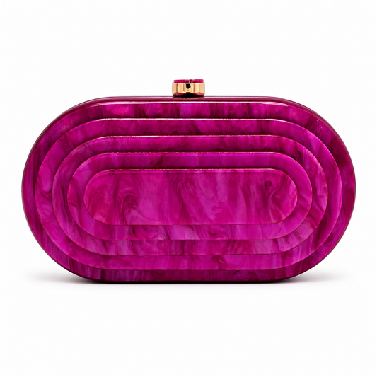 L’APOGÉE Olympia Clutch in Fuchsia layered oval acrylic clutch featuring vibrant fuchsia marbled tones and a sculptural concentric silhouette designed for parties, fashion events, and bold statement styling.
