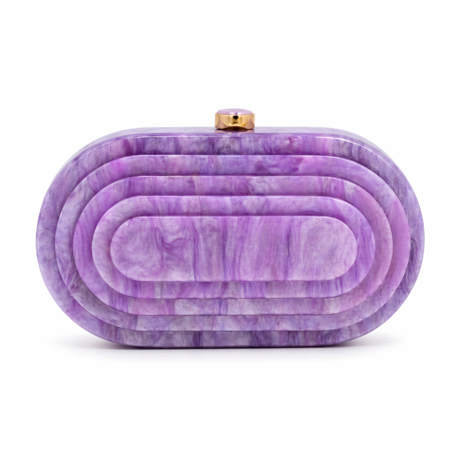 L’APOGÉE Olympia in Lila layered oval acrylic clutch featuring soft lilac marbled tones and a sculptural concentric silhouette designed for parties, weddings, and feminine occasion styling.