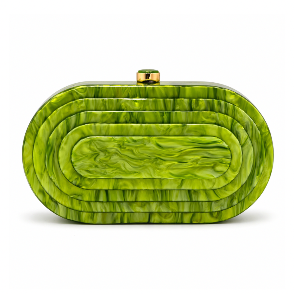 L’APOGÉE Olympia in Pistache layered oval acrylic clutch featuring glossy pistachio green marbled tones and a sculptural concentric silhouette designed for vacations, brunches, and statement occasion styling.