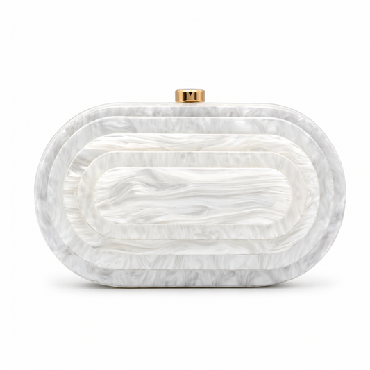 L’APOGÉE Olympia in White layered oval acrylic clutch featuring glossy white marbled tones and a sculptural concentric silhouette designed for weddings, formal events, and elegant evening styling.
