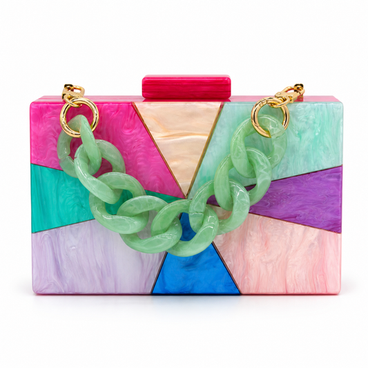 L’APOGÉE Orion rectangular acrylic clutch featuring multicolor geometric marbled tones, a chunky mint chain detail, and a bold statement silhouette designed for parties, vacations, and artistic fashion styling.