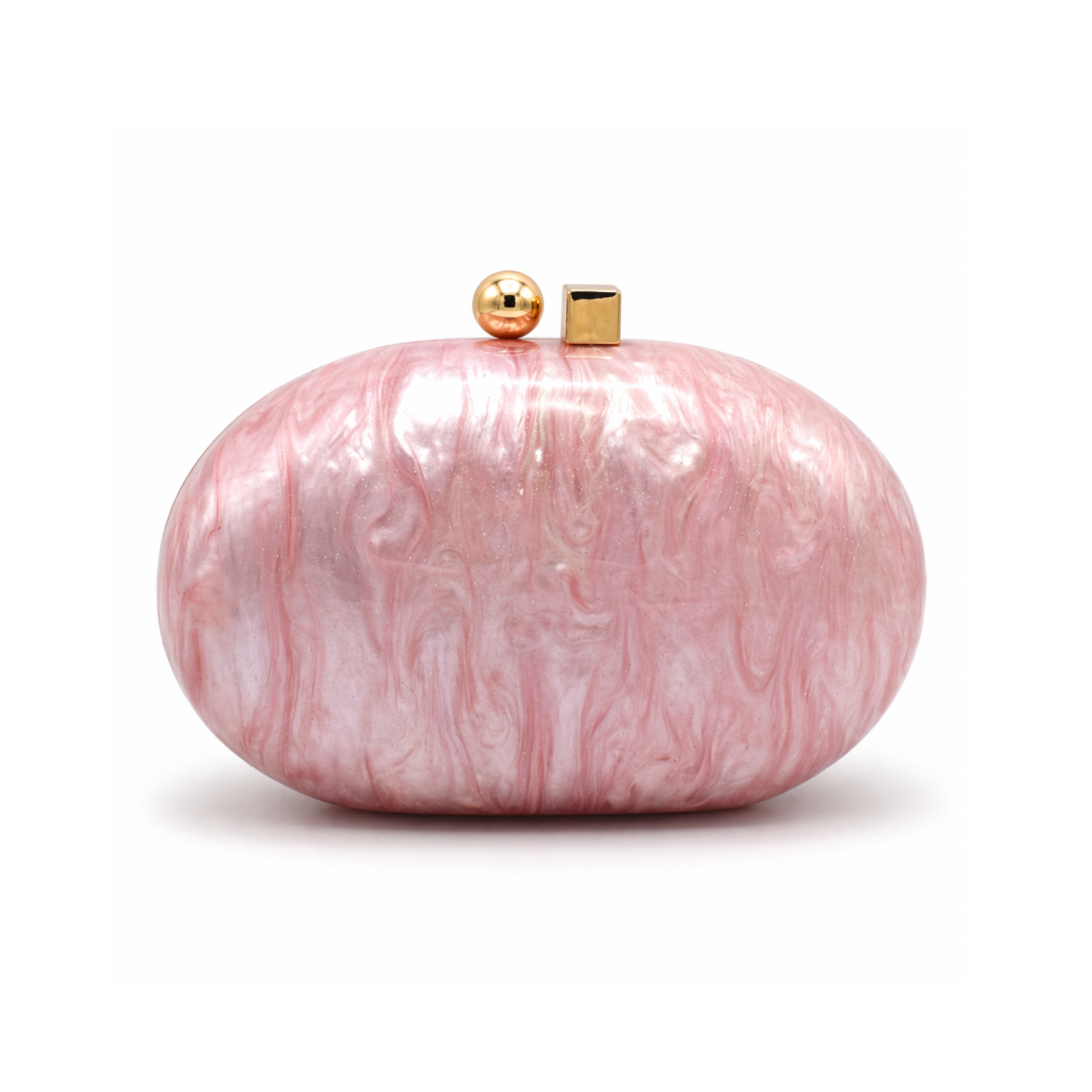L’APOGÉE Pluto in Pink round sculptural acrylic evening bag featuring glossy pink marbled tones and a statement circular silhouette designed for parties, brunches, date nights, and feminine occasion styling.