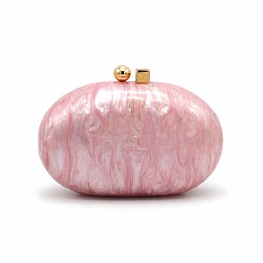 L’APOGÉE Pluto in Pink round sculptural acrylic evening bag featuring glossy pink marbled tones and a statement circular silhouette designed for parties, brunches, date nights, and feminine occasion styling.