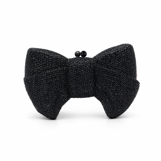 L’APOGÉE Pretty Please black bow evening bag featuring rhinestone embellishments designed for weddings, formal events, and glamorous occasion styling.