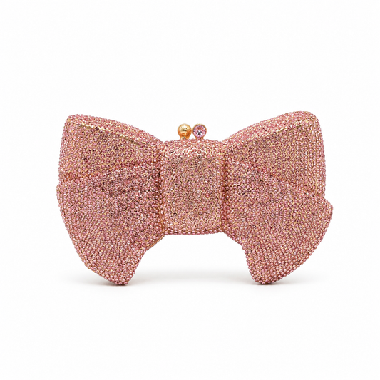 L’APOGÉE Pretty Please Pink bow evening bag featuring rhinestone embellishments designed for weddings, formal events, and glamorous occasion styling.