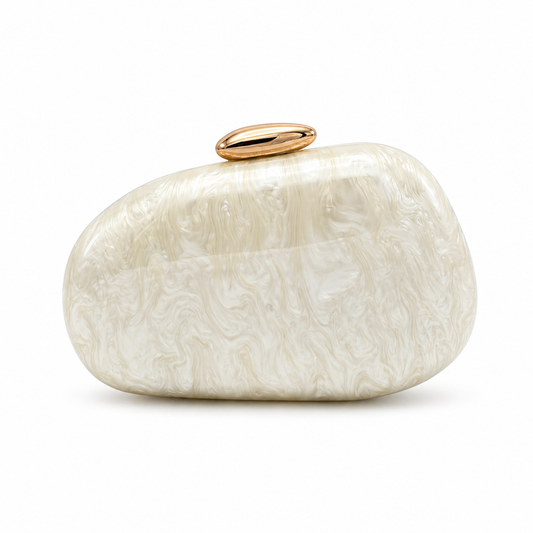 L’APOGÉE Puissance in Ivory sculptural oval acrylic evening bag featuring pearly ivory marbled tones and a glossy gold clasp designed for weddings, formal events, and elegant occasion styling.
