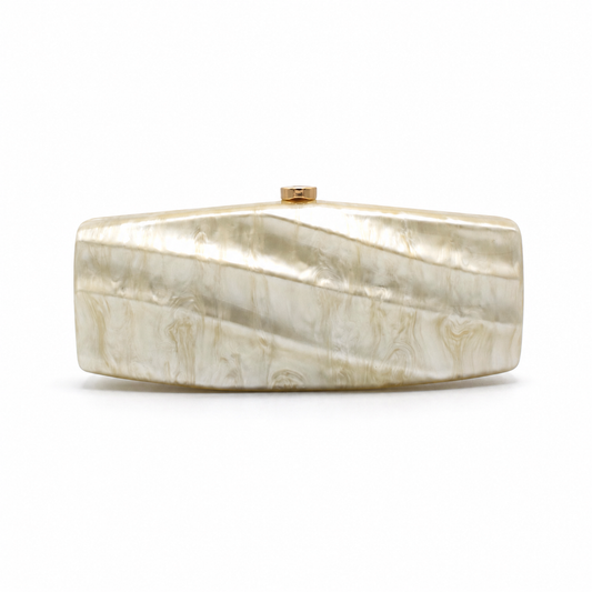 L’APOGÉE Solene elongated rectangular acrylic evening bag featuring pearly ivory marbled tones and a sleek sculptural silhouette designed for weddings, formal events, and elegant minimalist occasion styling.
