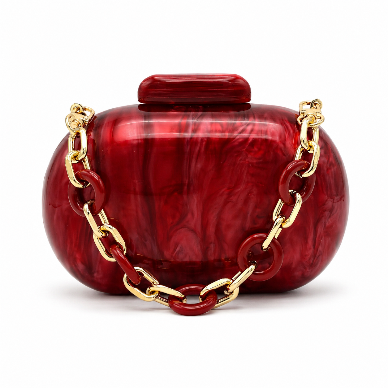 L’APOGÉE Stellar in Ruby marbled acrylic evening bag featuring deep ruby red tones and a sculptural gold chain detail designed for parties, formal events, and bold statement occasion styling.